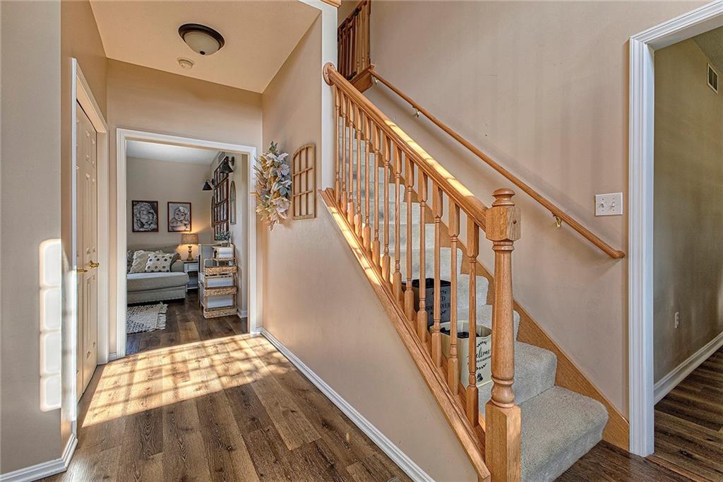142 Lentz Road Latrobe, PA 15650 - Photo 4 of 32 a view of hallway with wooden floor and stairs