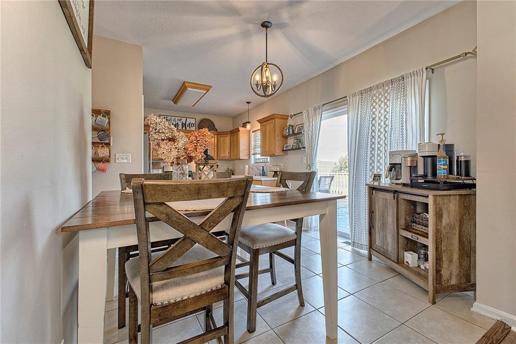 142 Lentz Road Latrobe, PA 15650 - Photo 10 of 32 a view of a dining room with furniture and a chandelier