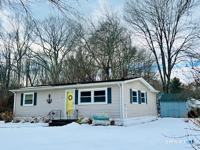 19 Old Forge Road Westbrook, CT 06498 - Photo 1 of 16 a view of a house with a yard covered in snow