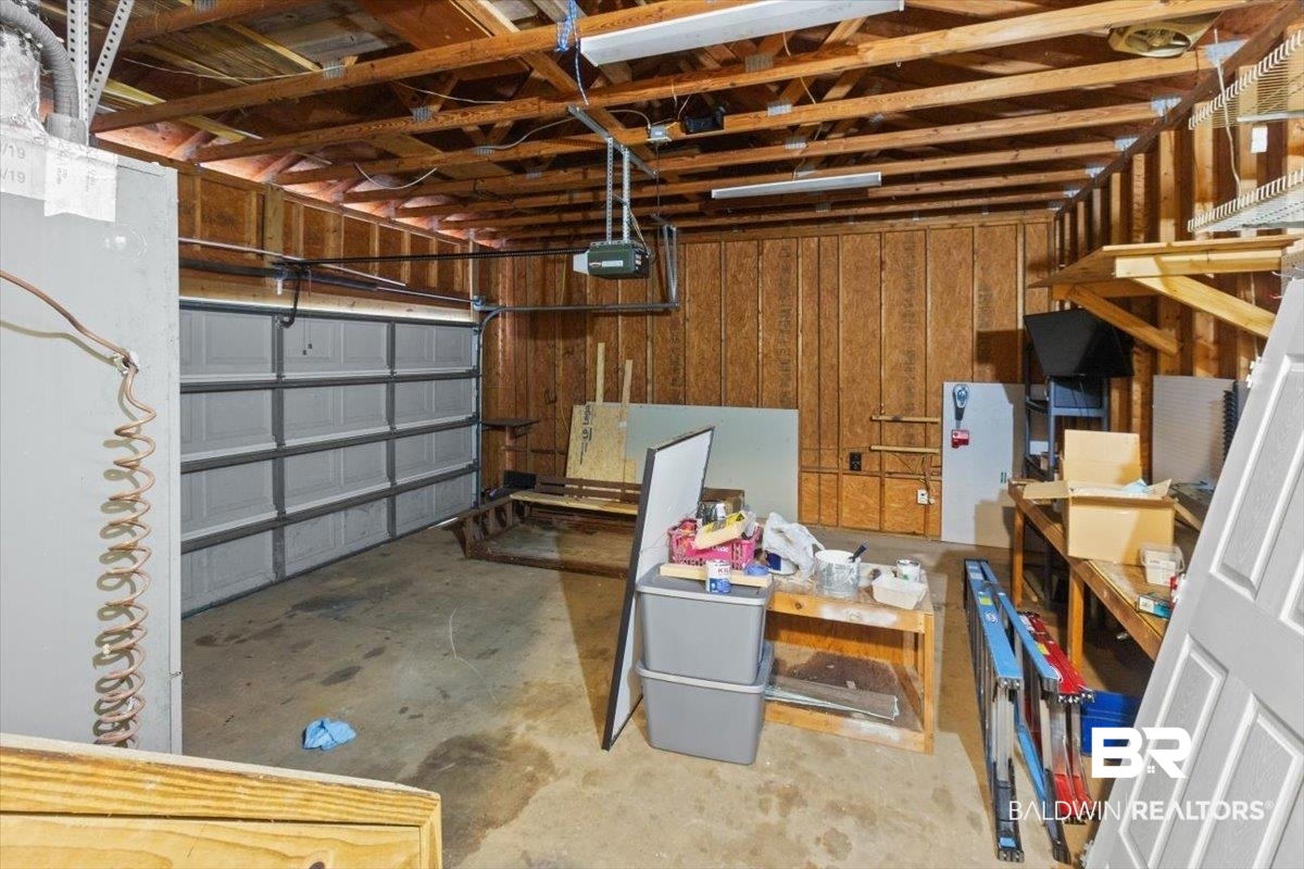 6971 March Road Theodore, AL 36582 - Photo 18 of 26 Garage with a garage door opener