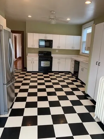 a bedroom with a bed dresser and a window