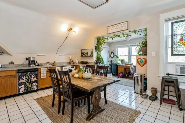 a balcony with chairs and wooden floor