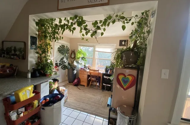 a bedroom with bed and the view of bathroom