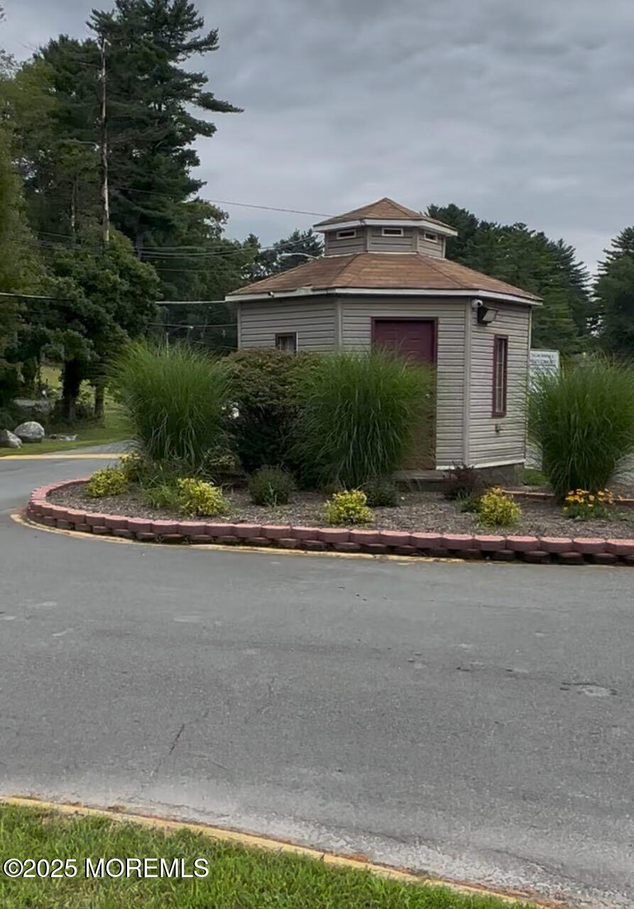606 Sleepy Hollow Road Montague, NJ 07827 - Photo 6 of 8 a front view of a house with garden