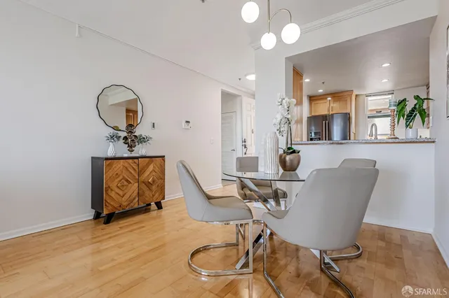 a view of a dining room with furniture and a chandelier