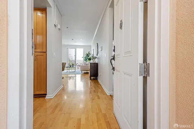 a view of a living room with a wooden floor