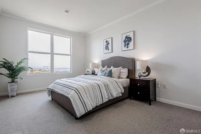 a spacious bedroom with a bed and a window