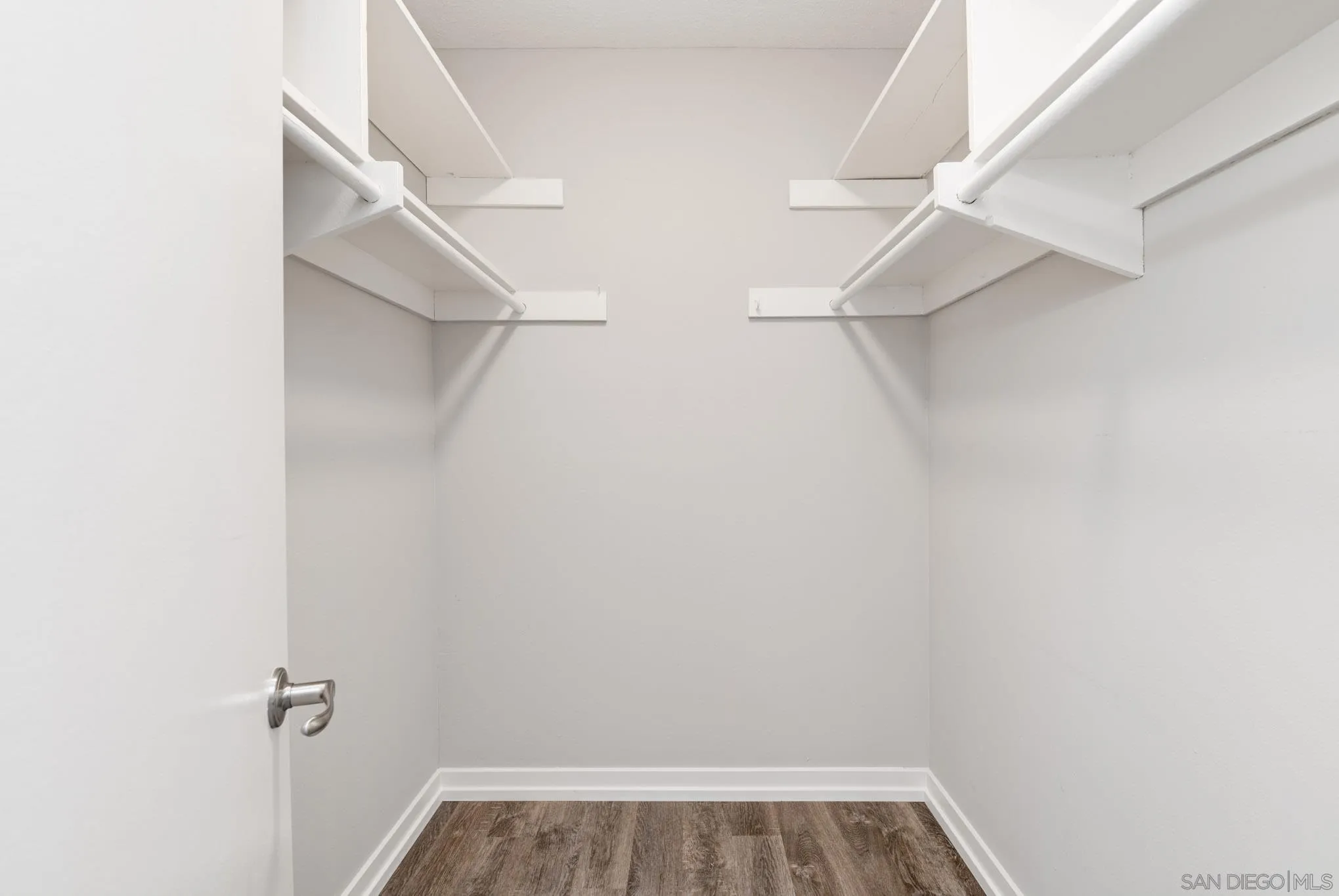 6775 Alvarado Road, Unit 21 San Diego, CA 92120 - Photo 12 of 27 a view of walk in closet with empty racks