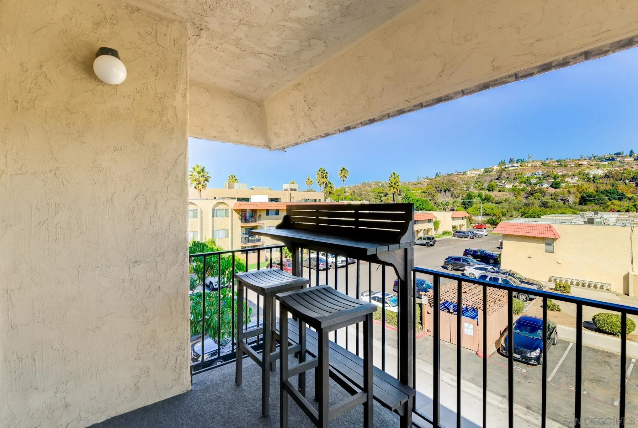 6775 Alvarado Road, Unit 21 San Diego, CA 92120 - Photo 20 of 27 a view of a balcony with furniture