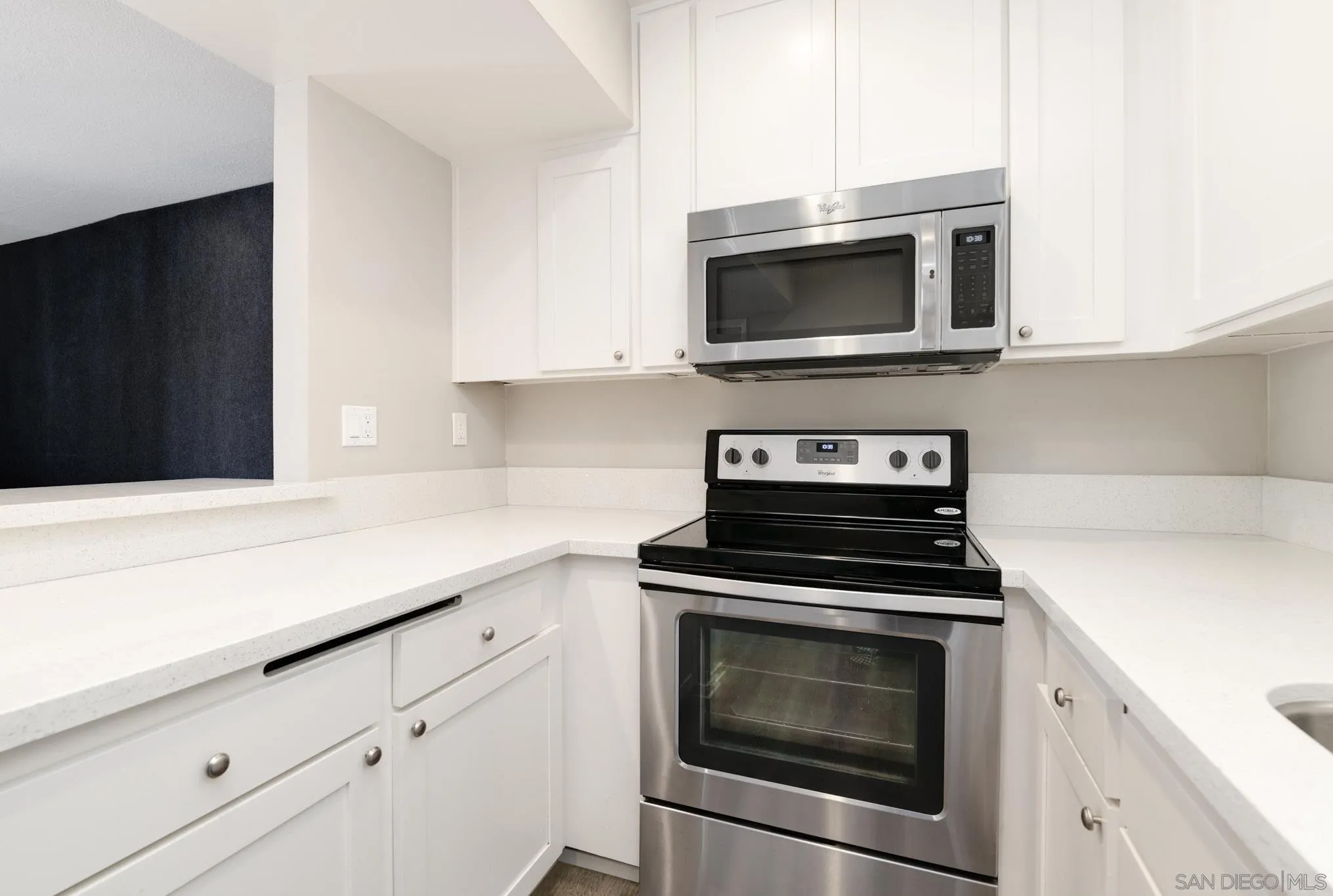 6775 Alvarado Road, Unit 21 San Diego, CA 92120 - Photo 3 of 27 a kitchen with stainless steel appliances a stove microwave and sink