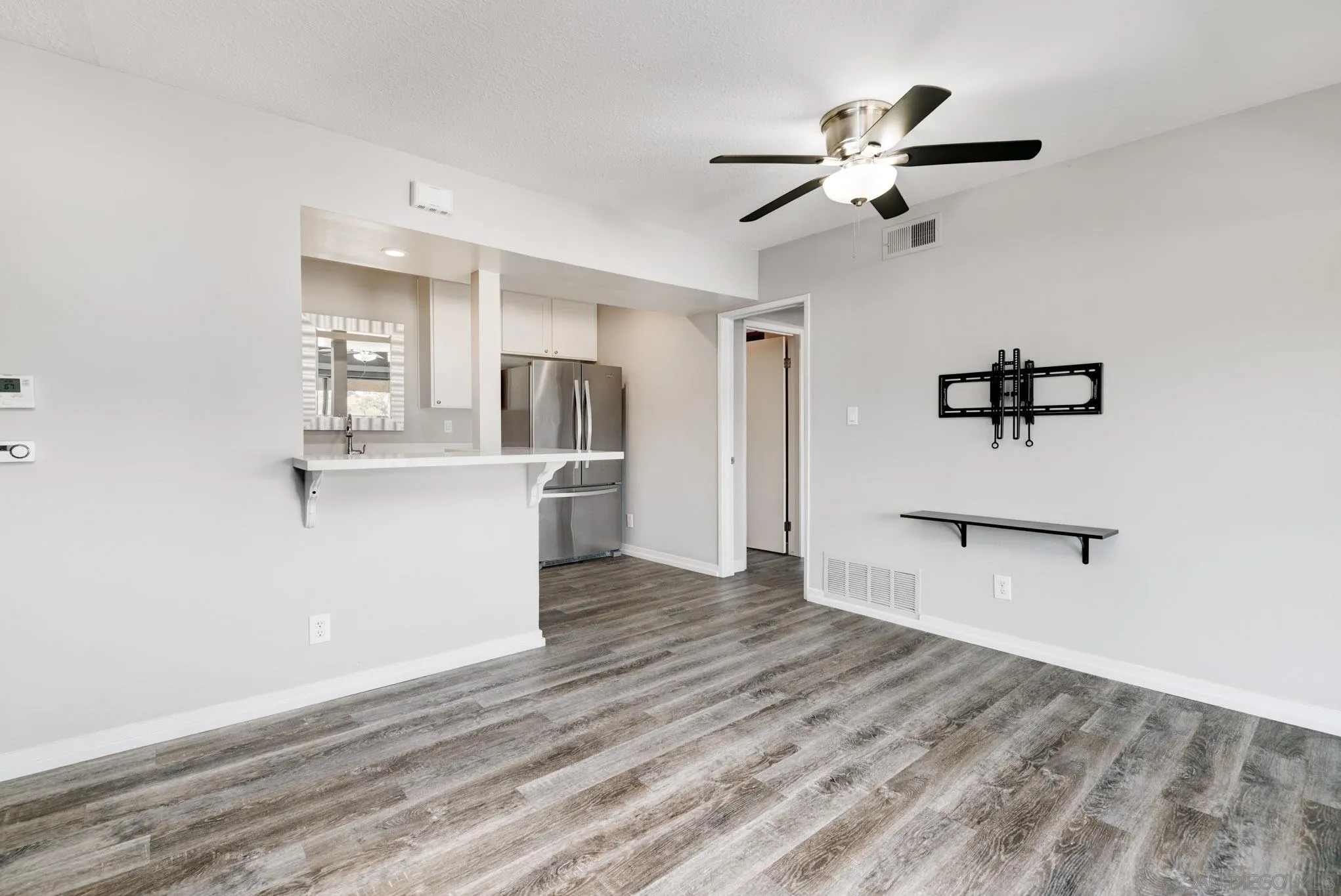 6775 Alvarado Road, Unit 21 San Diego, CA 92120 - Photo 6 of 27 a view of a kitchen with a sink and cabinet