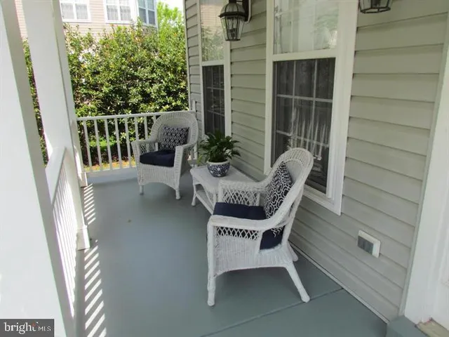 a view of balcony with chair and potted plant