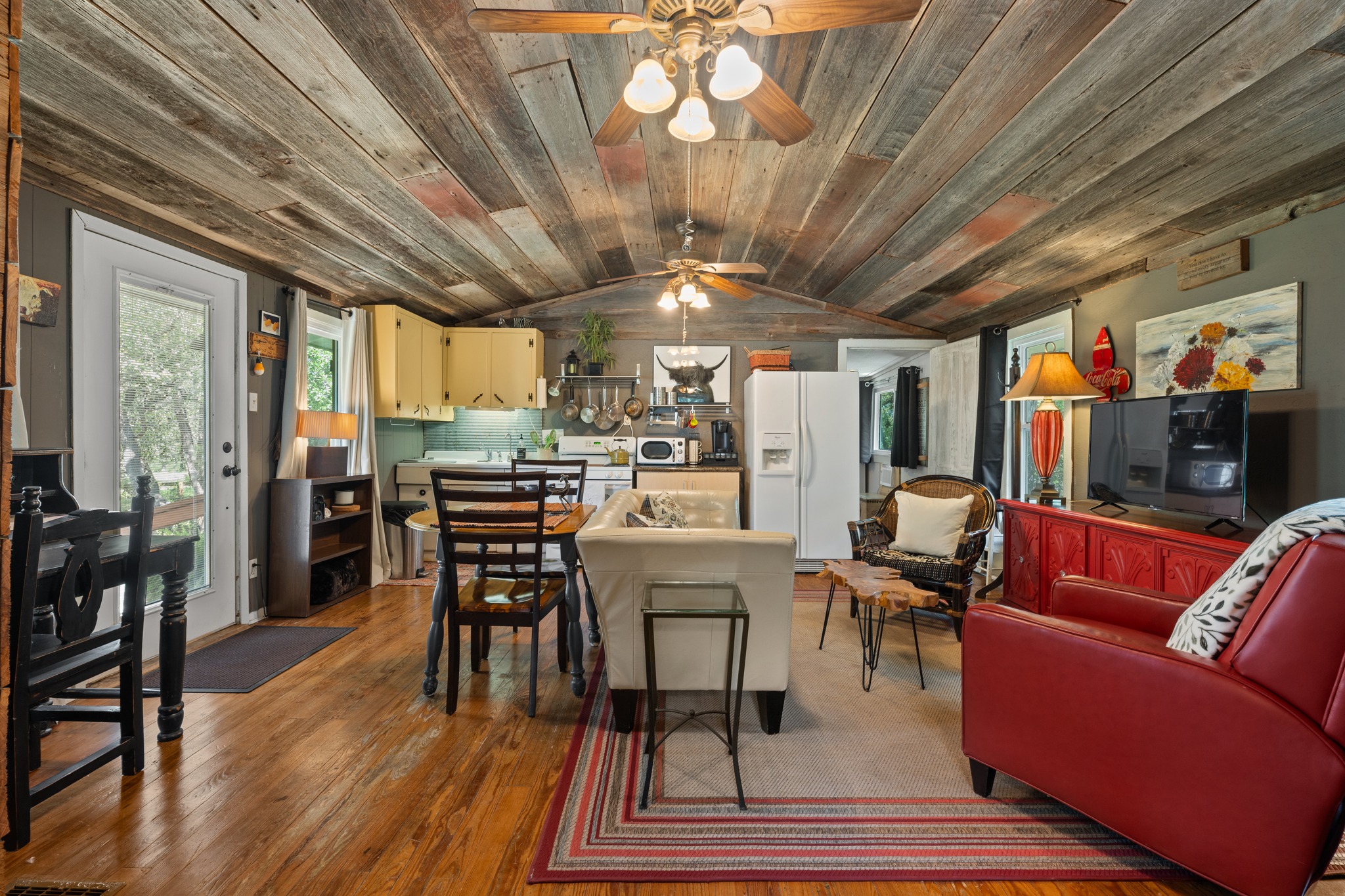 12932 Nutty Brown Road Austin, TX 78737 - Photo 16 of 40 The Cabin - Warm and inviting living area featuring reclaimed wood finishes and abundant natural light.