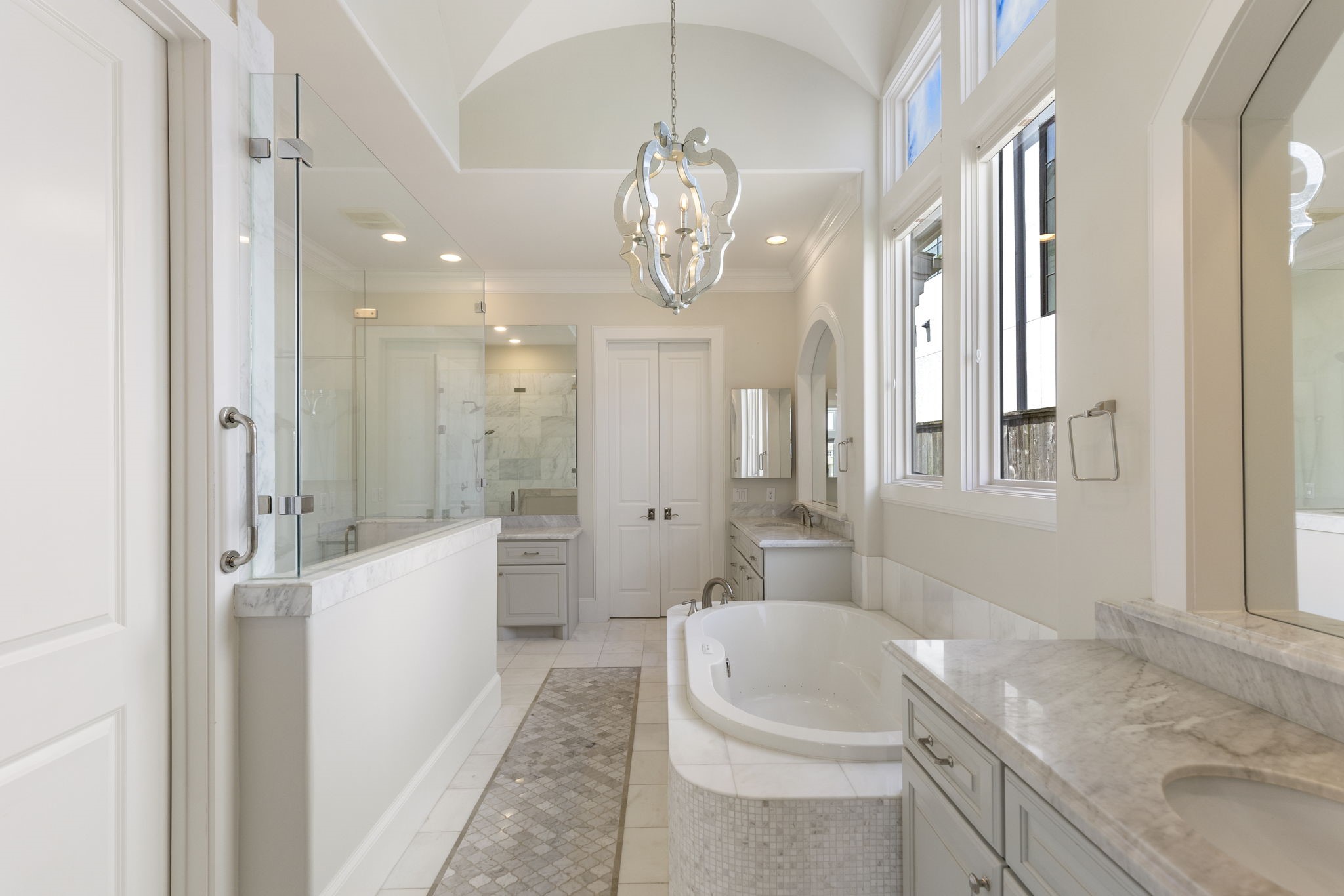 6806 West Warwick Lake Lane Spring, TX 77389 - Photo 20 of 50 a bathroom with a granite countertop sink a toilet a mirror and shower