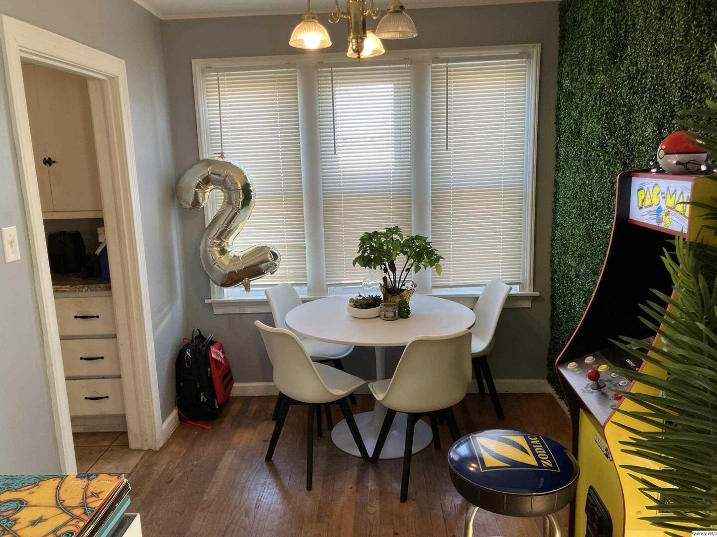 2415 Larch Road Quincy, IL 62301 - Photo 7 of 18 a view of a dining room with furniture and wooden floor