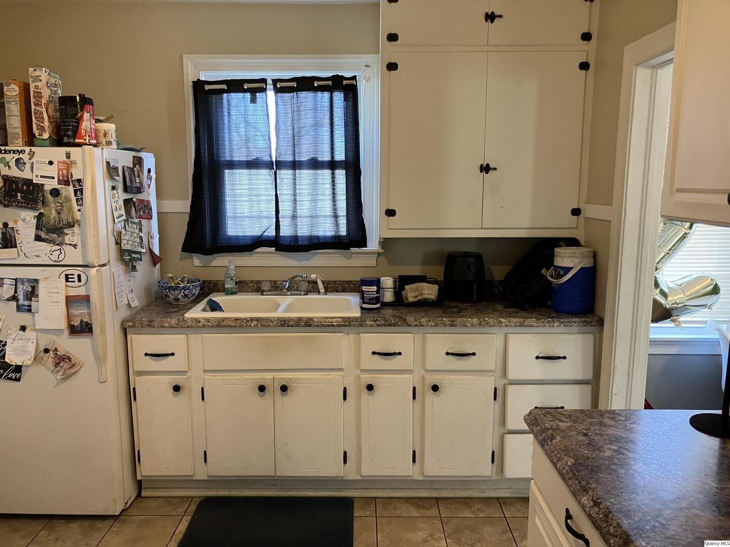 2415 Larch Road Quincy, IL 62301 - Photo 8 of 18 a bathroom with a sink and a mirror