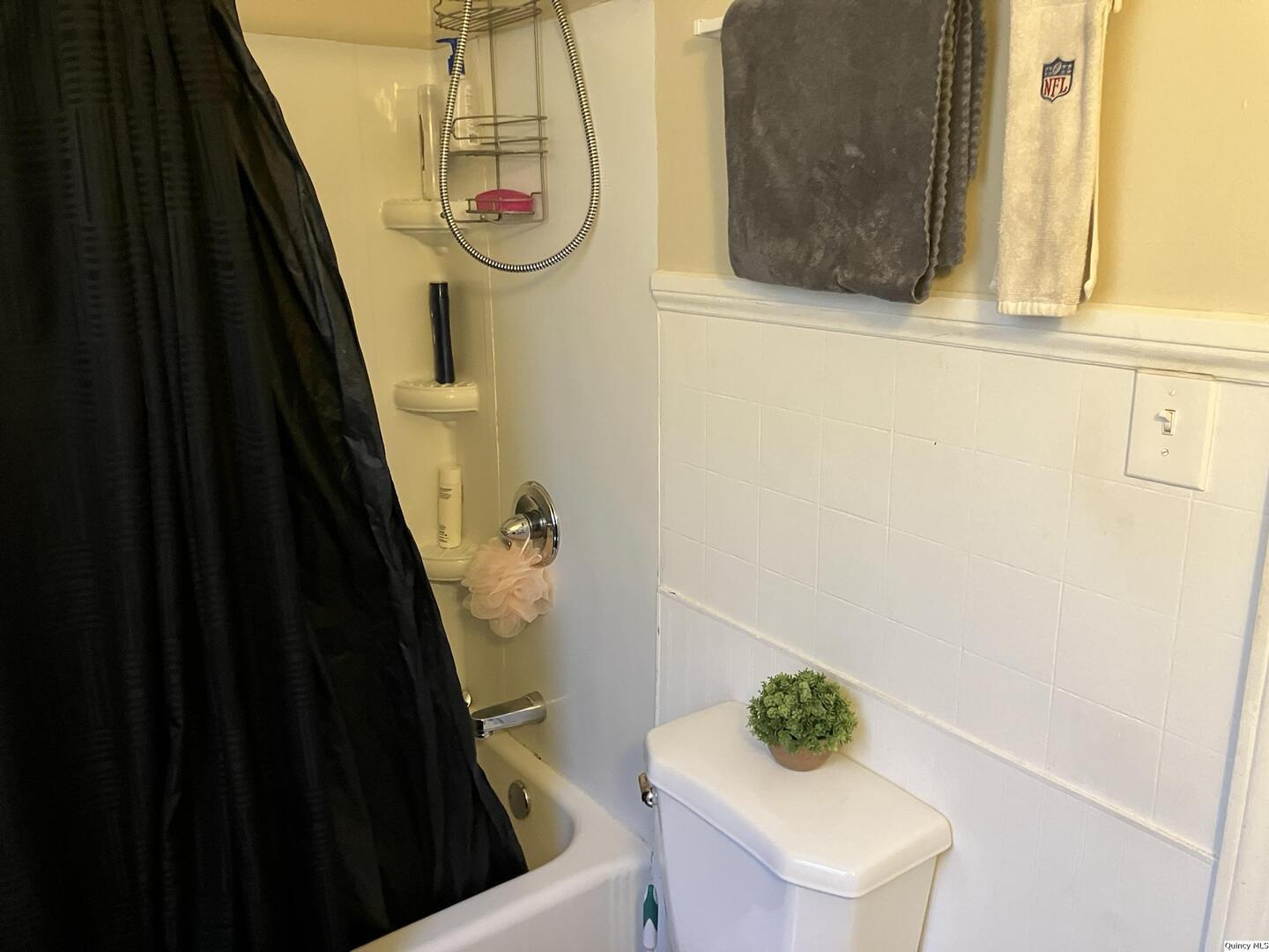 2415 Larch Road Quincy, IL 62301 - Photo 10 of 18 a bathroom with a sink and a mirror
