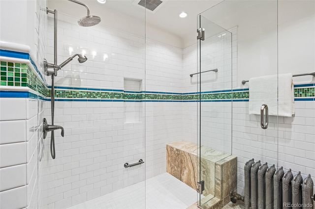 a bathroom with a shower and a shower