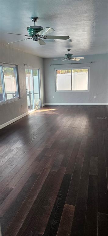 2075 North Keene Road Clearwater, FL 33755 - Photo 20 of 31 a view of an empty room with wooden floor and a window