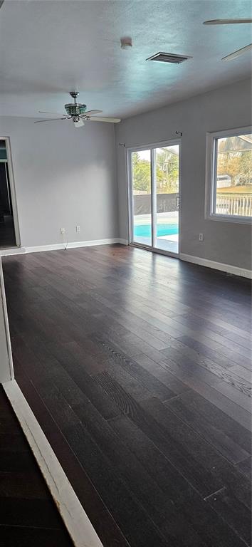 2075 North Keene Road Clearwater, FL 33755 - Photo 22 of 31 wooden floor in an empty room with a window