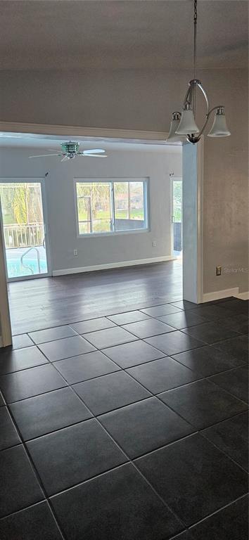 2075 North Keene Road Clearwater, FL 33755 - Photo 26 of 31 a view of empty room with window and wooden floor