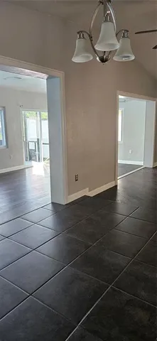 a view of empty room with windows