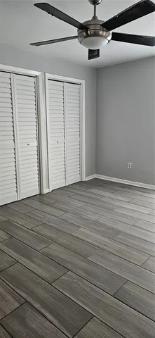 en empty room with wooden floor