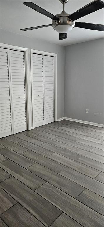 2075 North Keene Road Clearwater, FL 33755 - Photo 7 of 31 en empty room with wooden floor