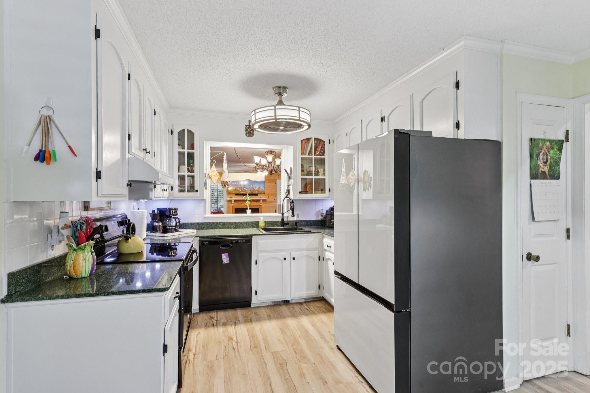 1590 Springpoint Road, Unit E Rock Hill, SC 29732 - Photo 12 of 38 a kitchen with stainless steel appliances granite countertop a refrigerator and a sink