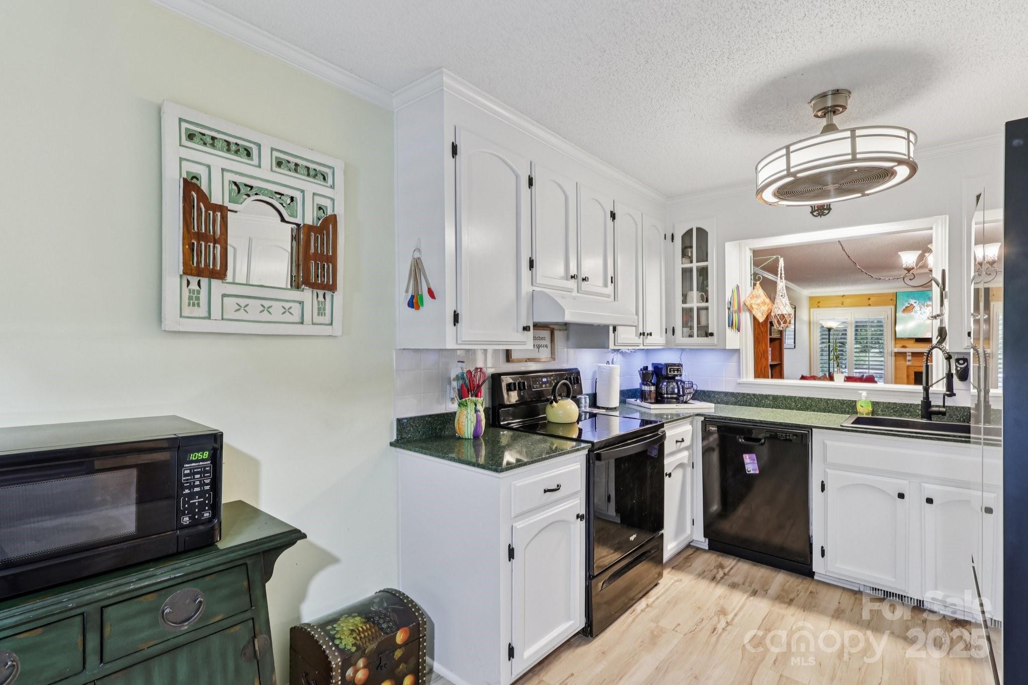 1590 Springpoint Road, Unit E Rock Hill, SC 29732 - Photo 14 of 38 a kitchen with a sink cabinets and window