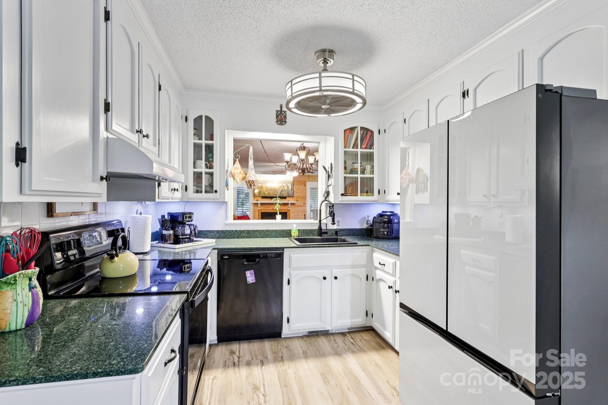 1590 Springpoint Road, Unit E Rock Hill, SC 29732 - Photo 15 of 38 a kitchen with stainless steel appliances granite countertop a sink stove and refrigerator
