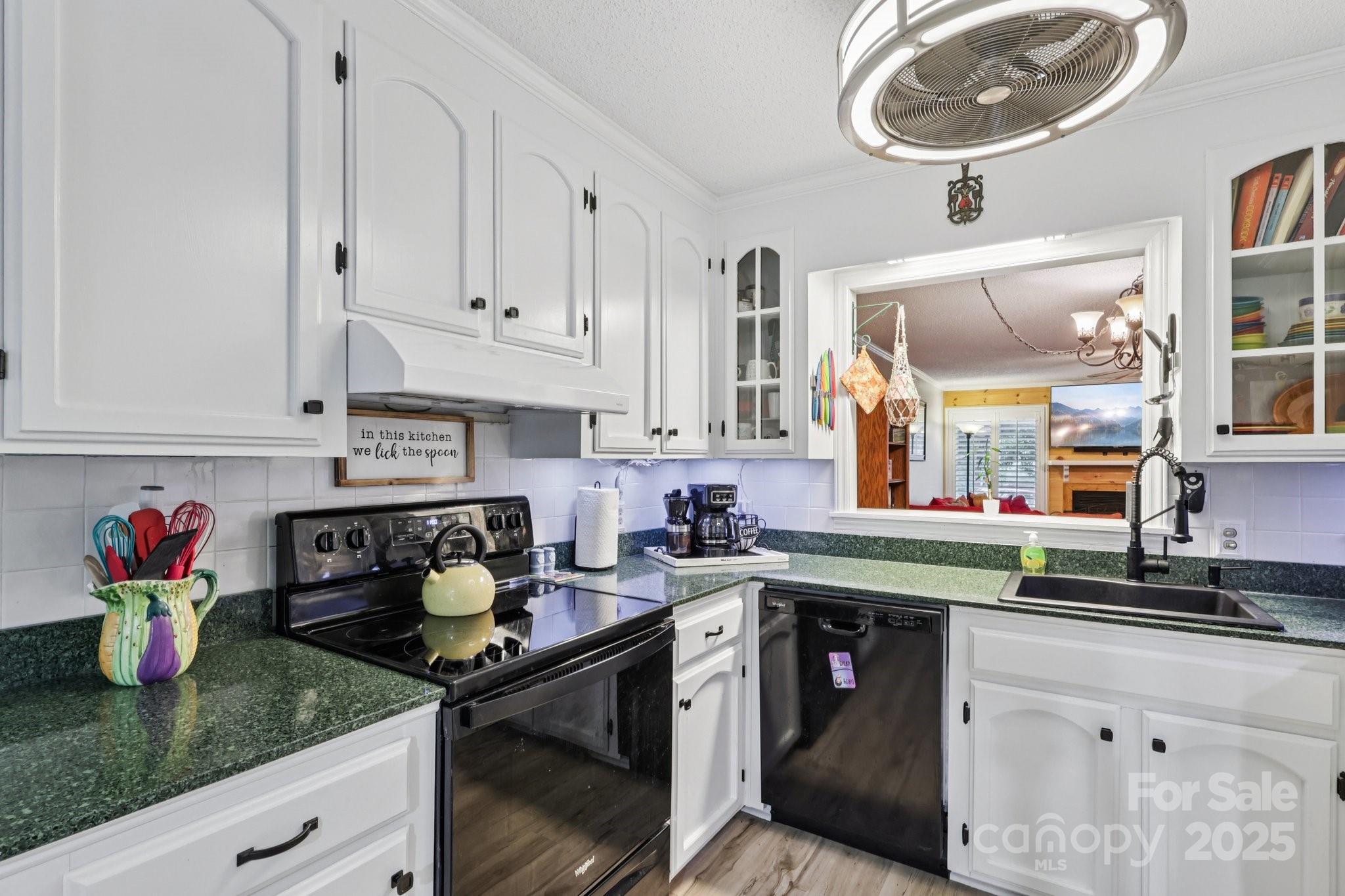 1590 Springpoint Road, Unit E Rock Hill, SC 29732 - Photo 16 of 38 a kitchen with stainless steel appliances granite countertop a sink dishwasher stove and cabinets