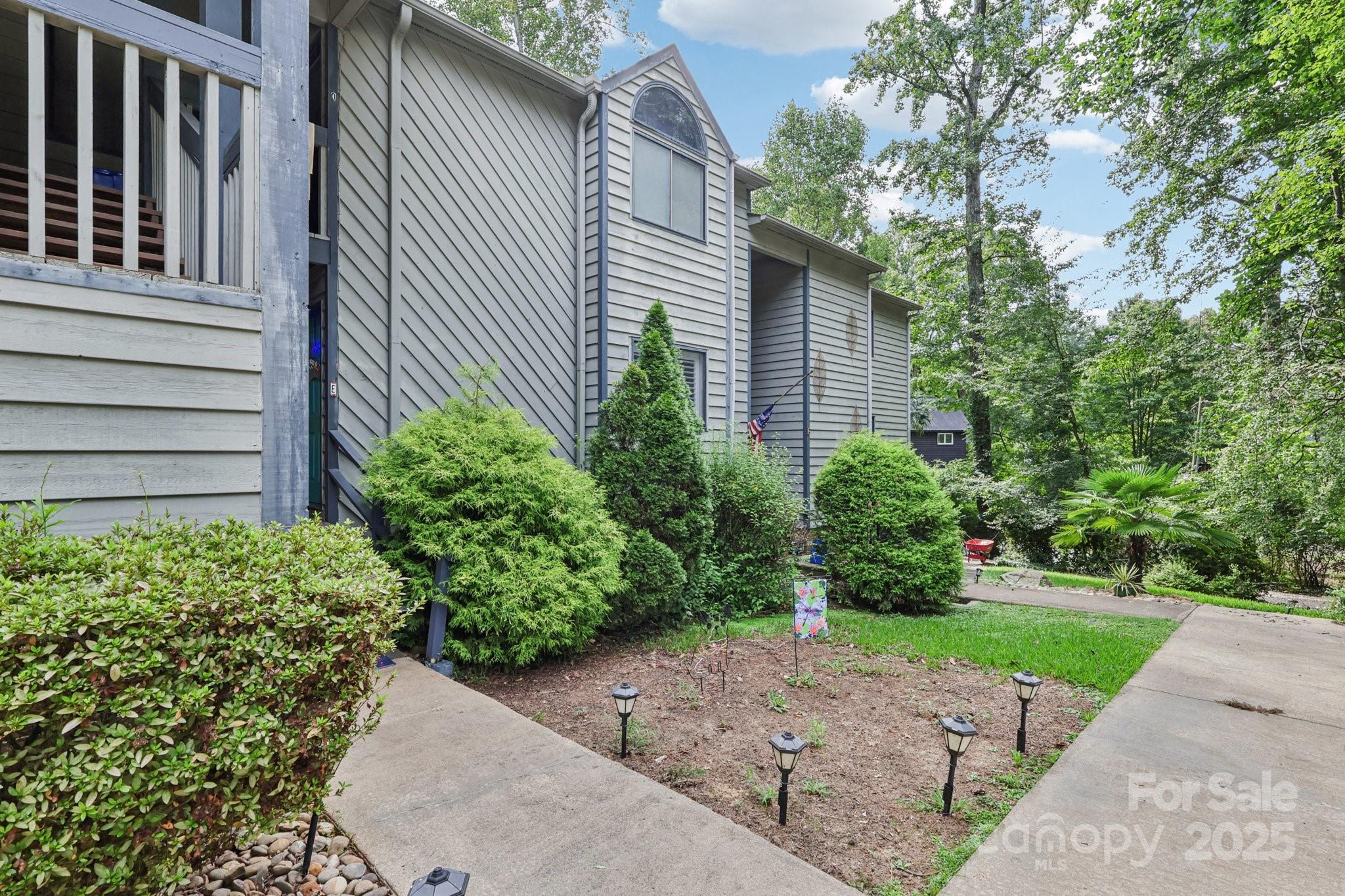 1590 Springpoint Road, Unit E Rock Hill, SC 29732 - Photo 2 of 38 a view of a backyard with plants