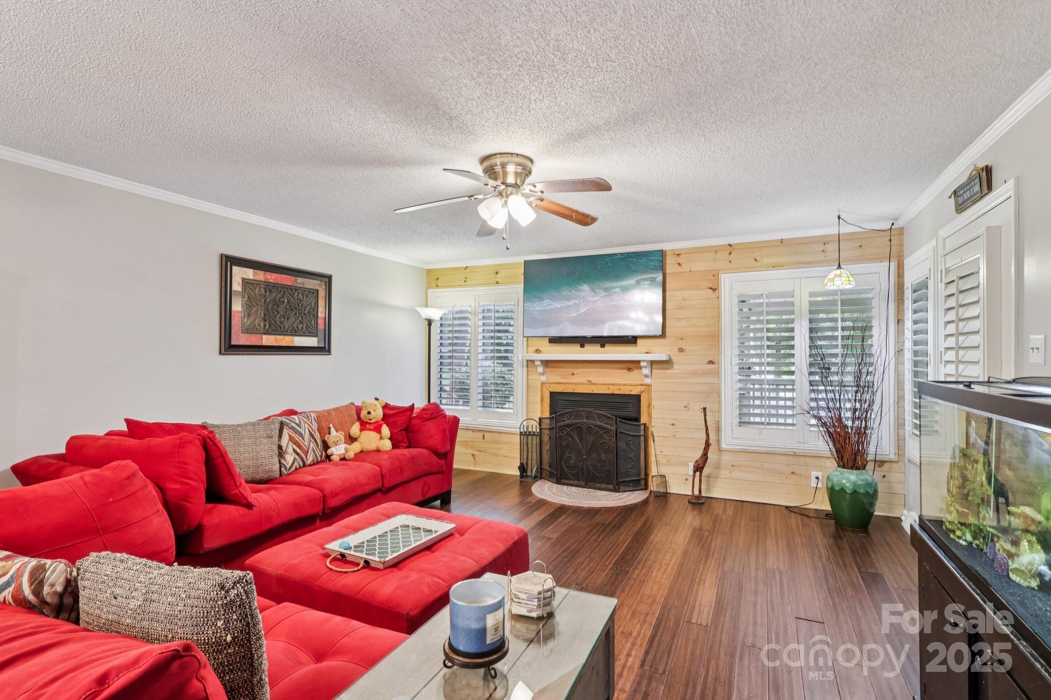 1590 Springpoint Road, Unit E Rock Hill, SC 29732 - Photo 21 of 38 a living room with furniture fireplace and wooden floor