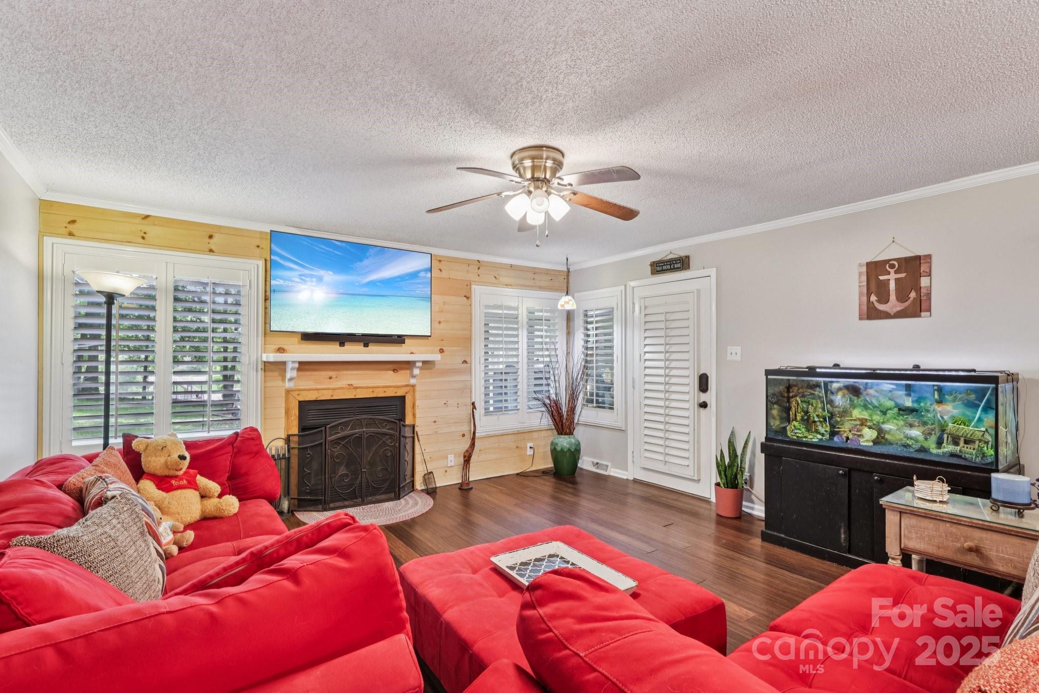 1590 Springpoint Road, Unit E Rock Hill, SC 29732 - Photo 22 of 38 a living room with furniture a flat screen tv and a fireplace