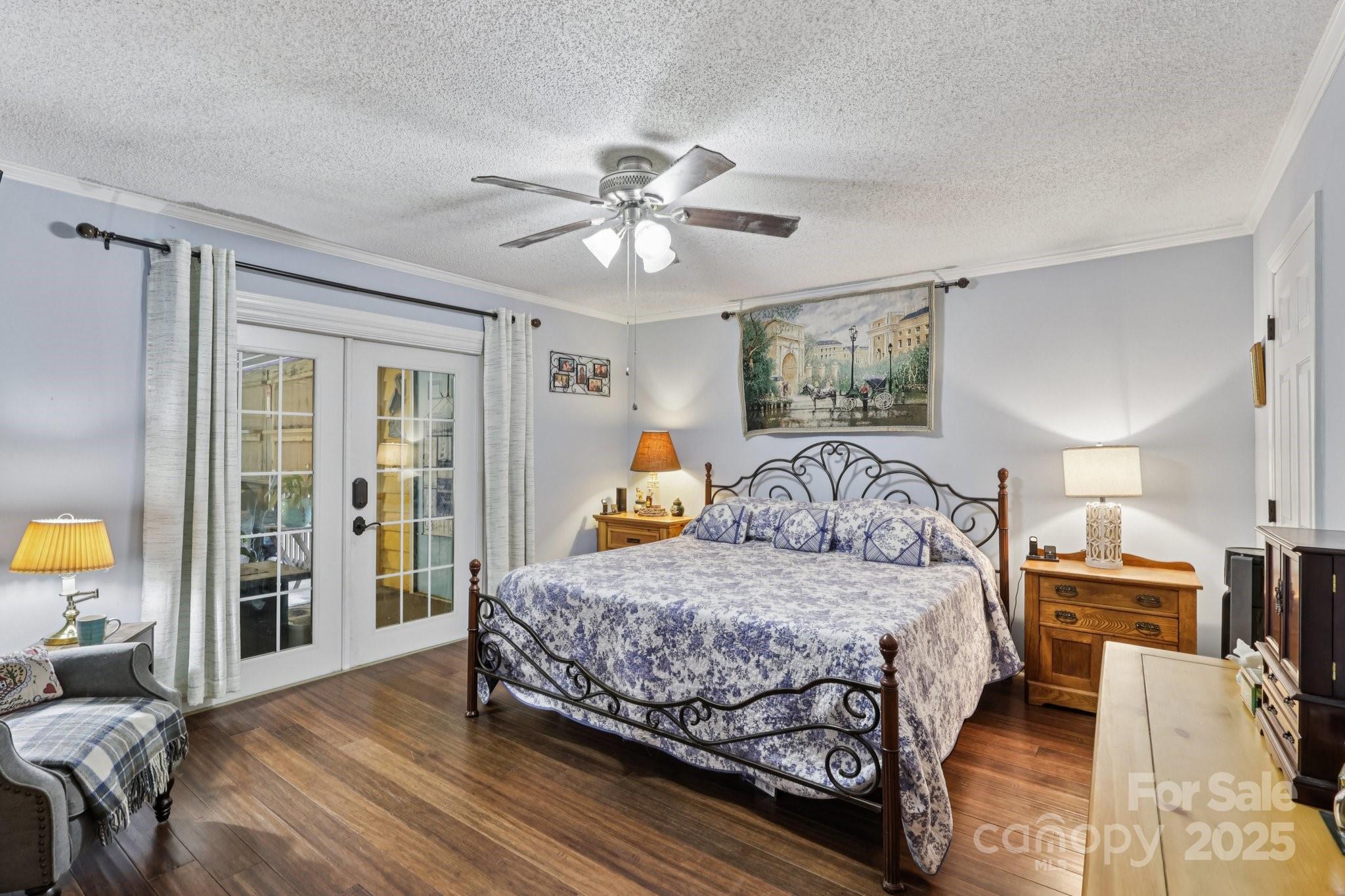 1590 Springpoint Road, Unit E Rock Hill, SC 29732 - Photo 27 of 38 a bedroom with a large bed and a chandelier