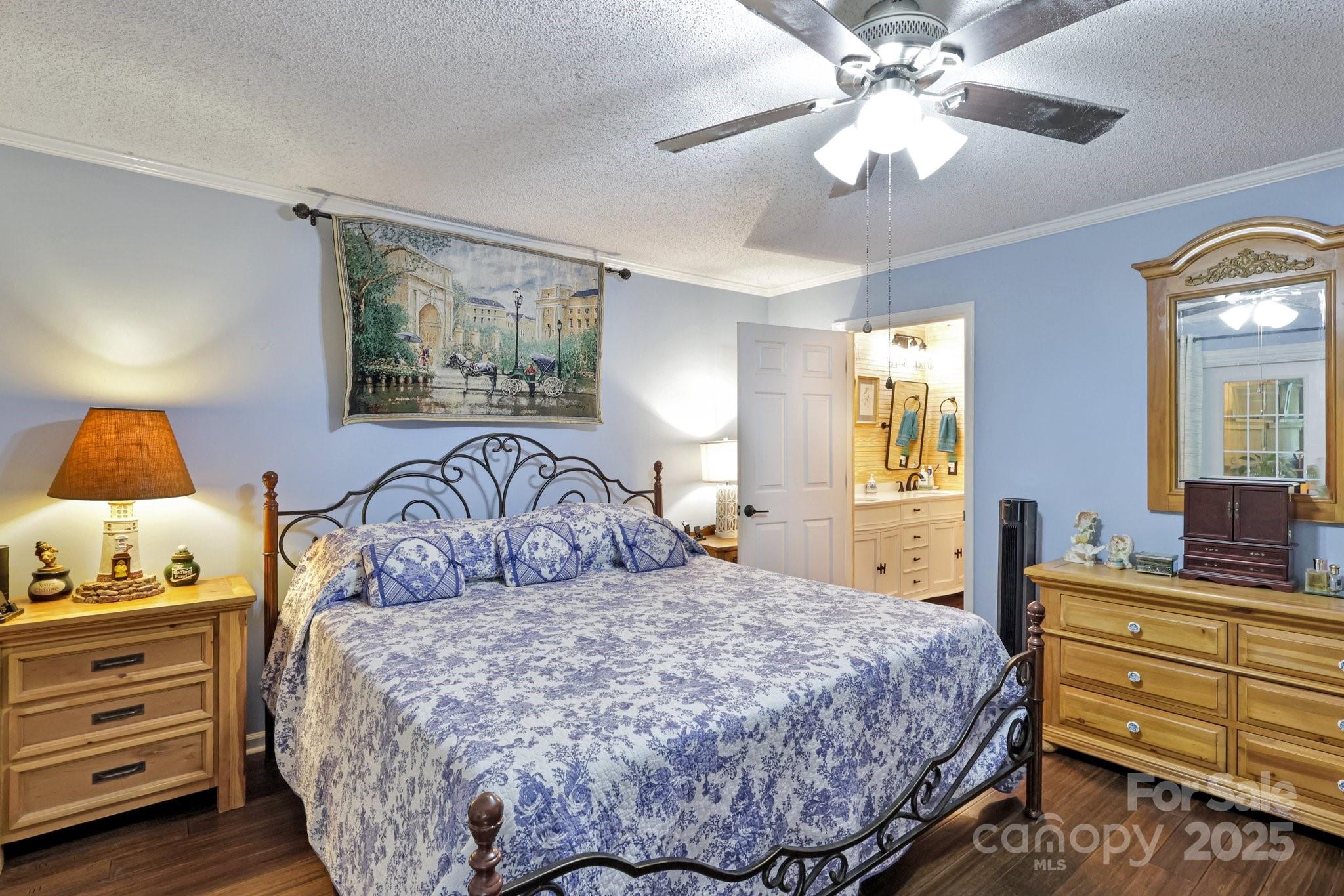 1590 Springpoint Road, Unit E Rock Hill, SC 29732 - Photo 28 of 38 a bedroom with a bed and a chandelier
