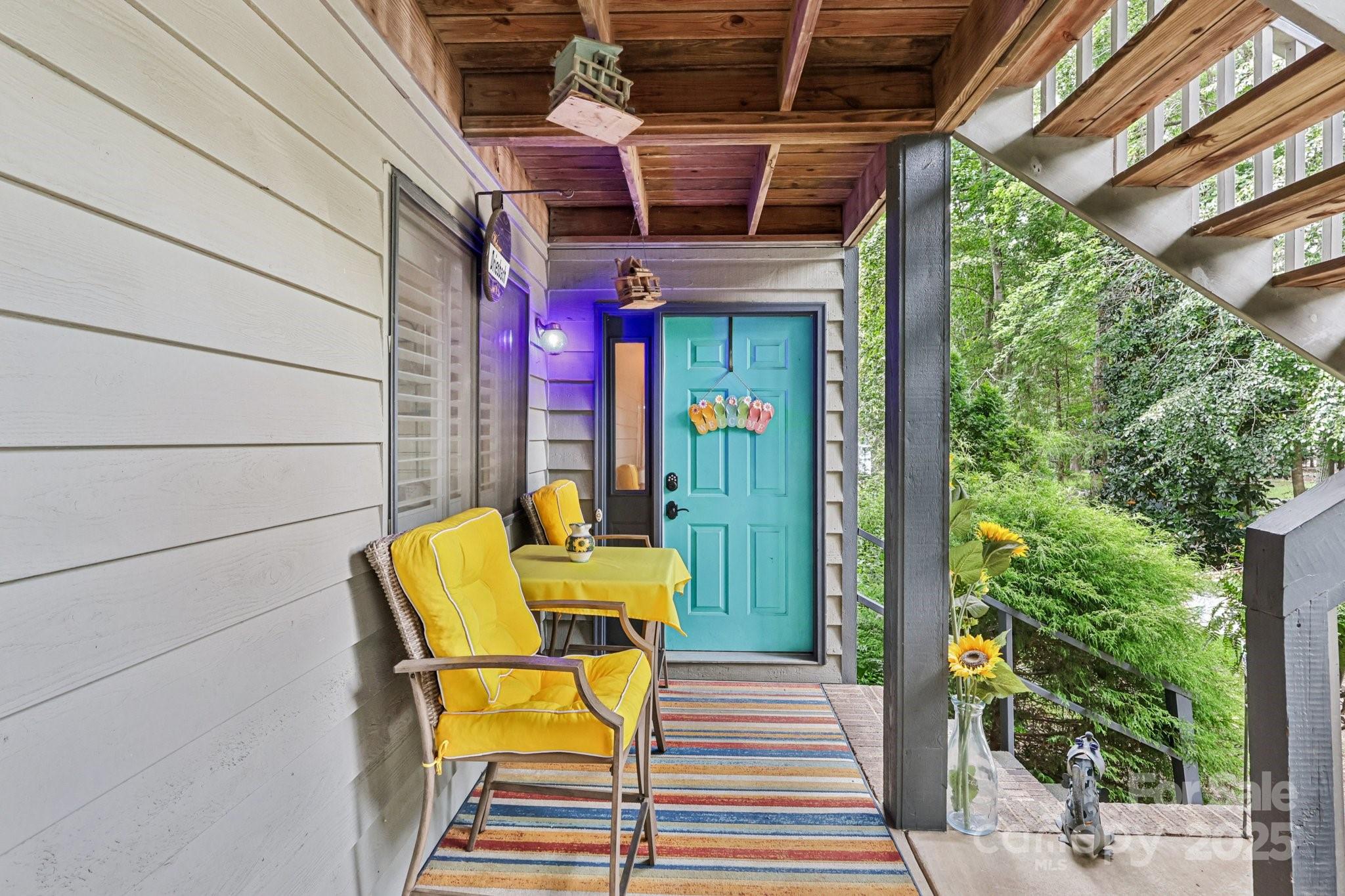 1590 Springpoint Road, Unit E Rock Hill, SC 29732 - Photo 4 of 38 a view of a patio with table and chairs with wooden floor and plants