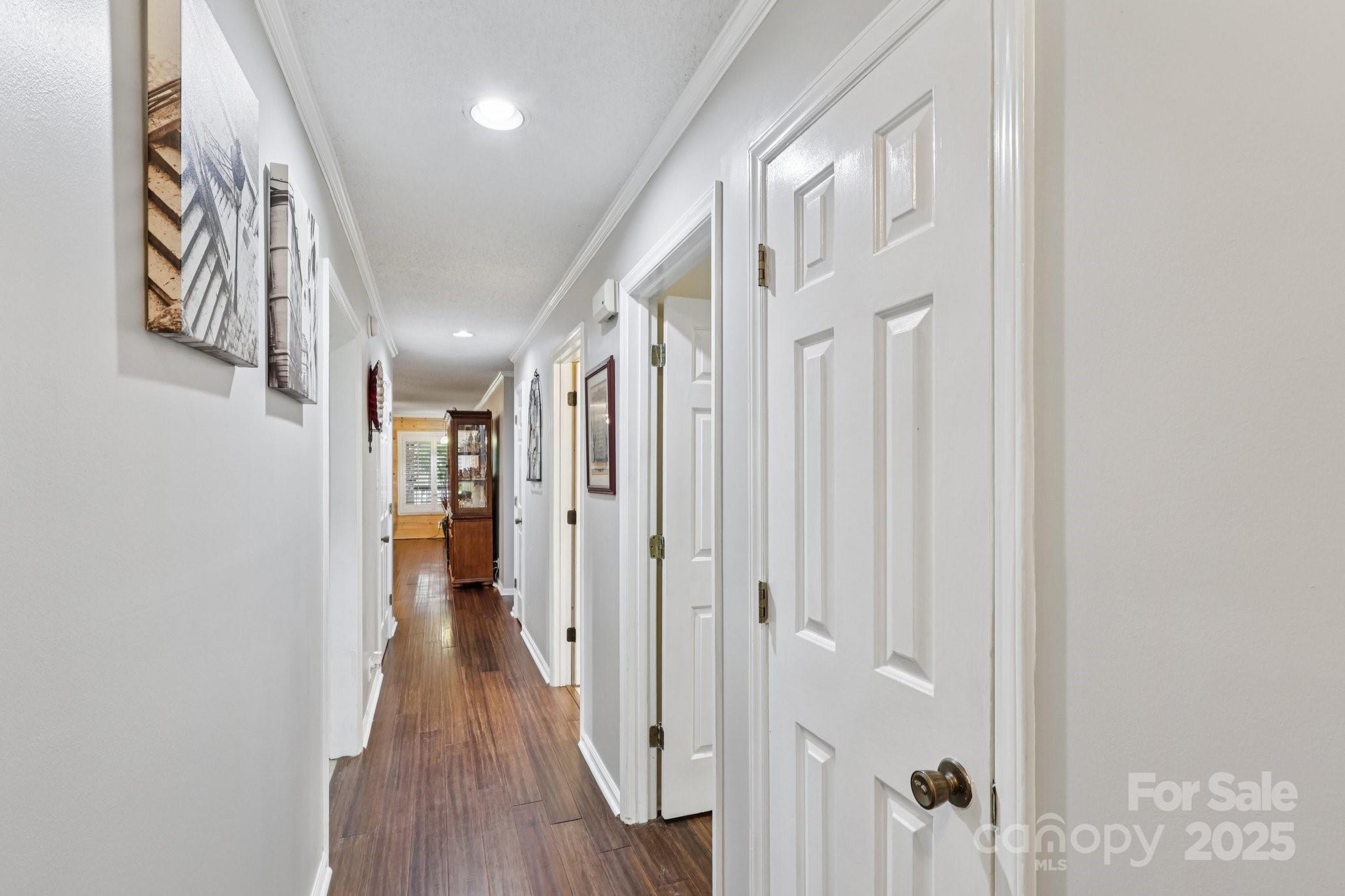 1590 Springpoint Road, Unit E Rock Hill, SC 29732 - Photo 6 of 38 a view of a hallway with wooden floor and staircase
