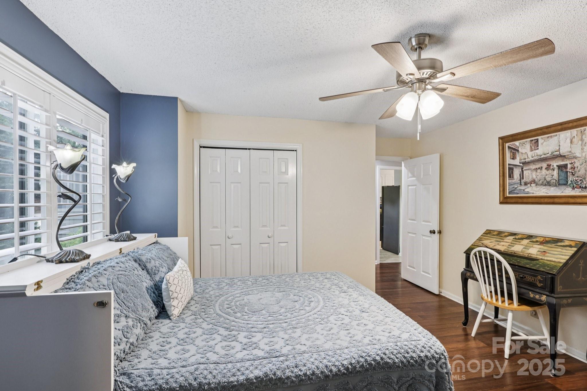 1590 Springpoint Road, Unit E Rock Hill, SC 29732 - Photo 8 of 38 a bedroom with a bed and wooden floor
