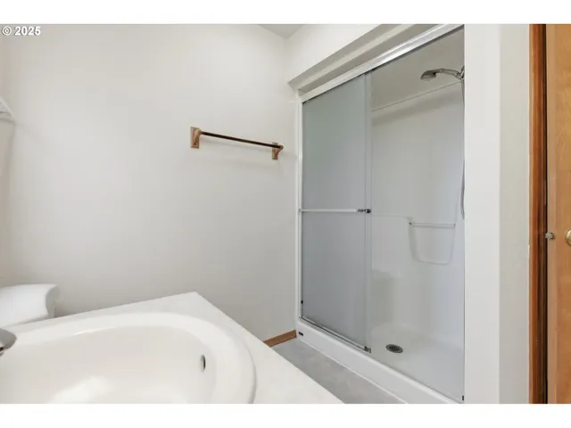 a view of a bathroom from a hallway