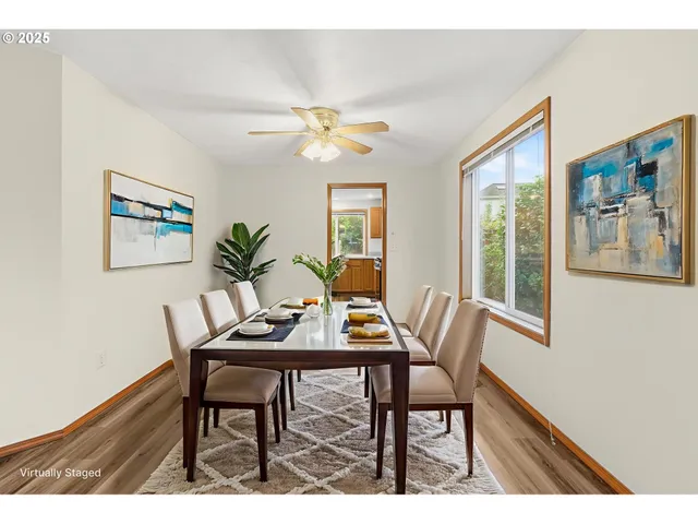 a view of a dining room with furniture a chandelier and wooden floor