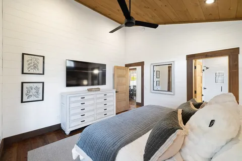 a bathroom with a couch and a large window