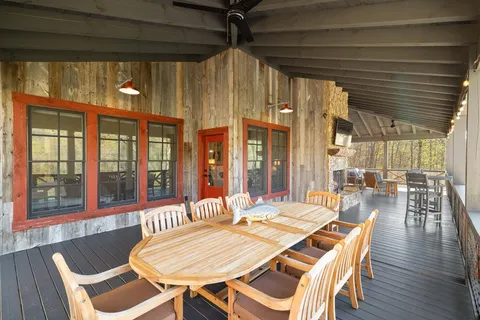 a view of a room with wooden floor and fence