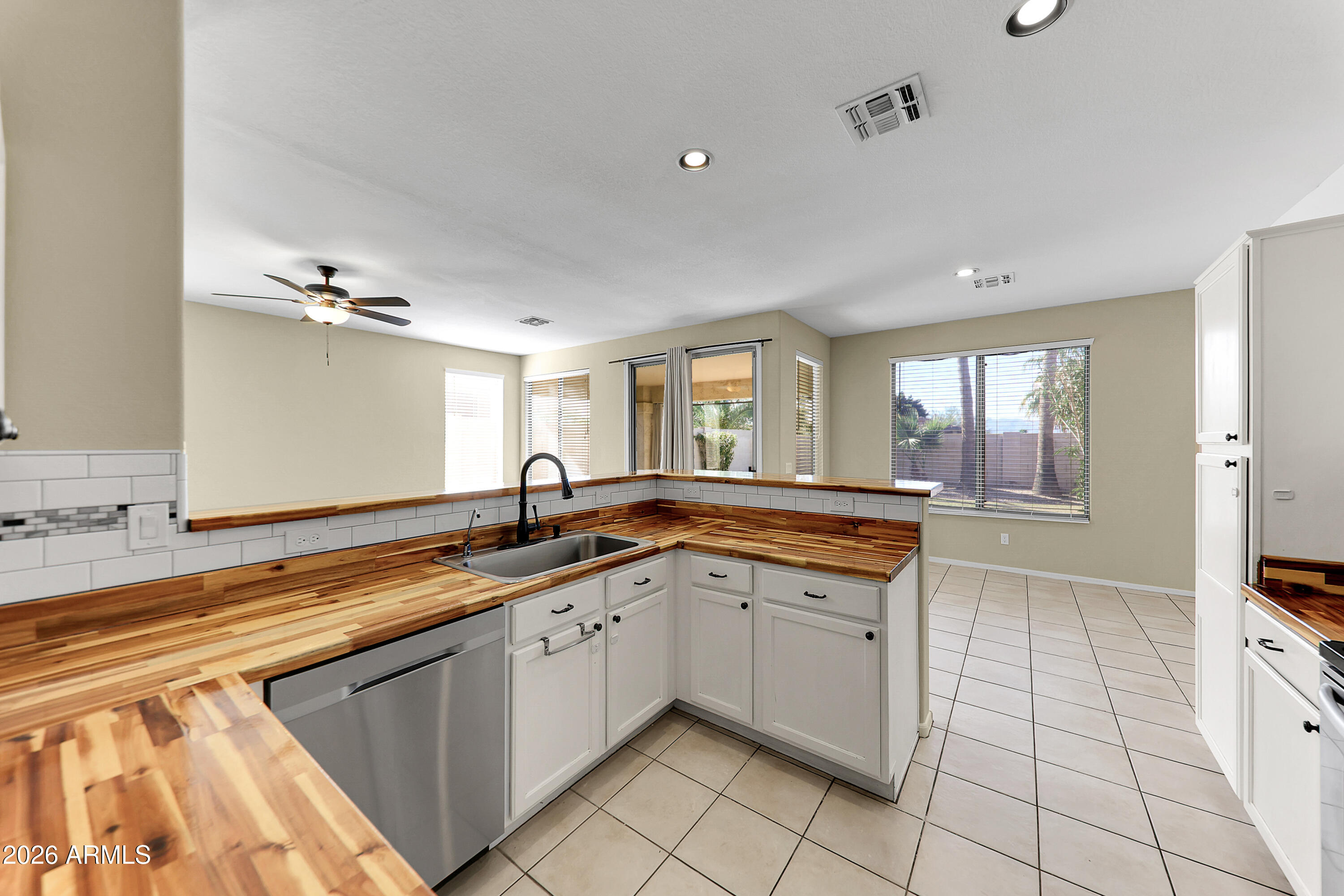 1819 West Nighthawk Way Phoenix, AZ 85045 - Photo 11 of 25 a large kitchen with a sink and cabinets