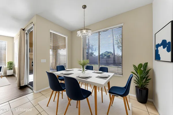 a dining room with furniture window and outdoor view