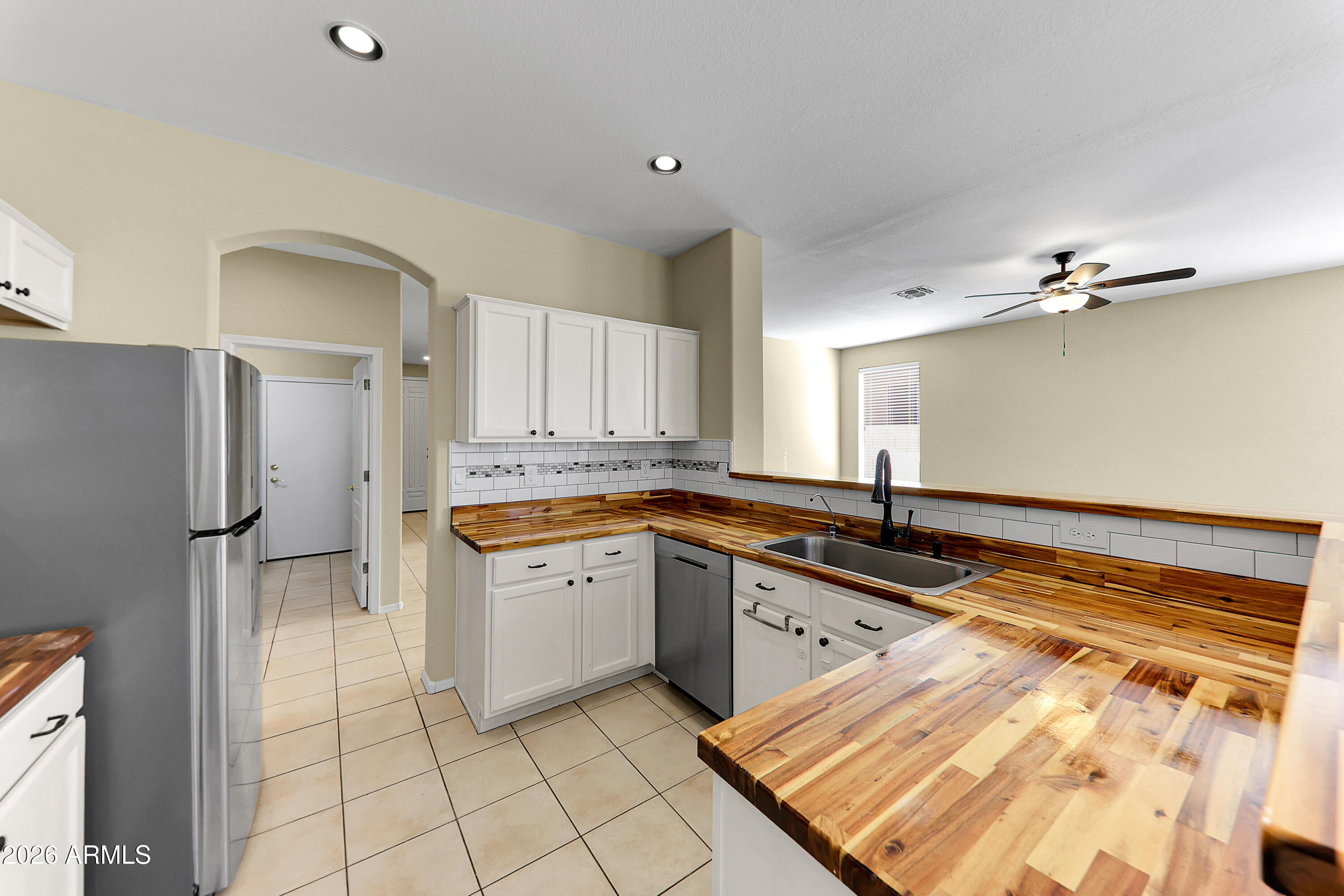 1819 West Nighthawk Way Phoenix, AZ 85045 - Photo 14 of 25 a large kitchen with granite countertop a sink and cabinets