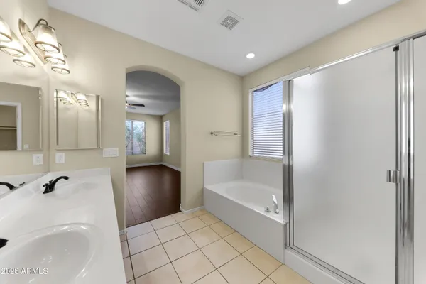 a bathroom with a bathtub and a sink