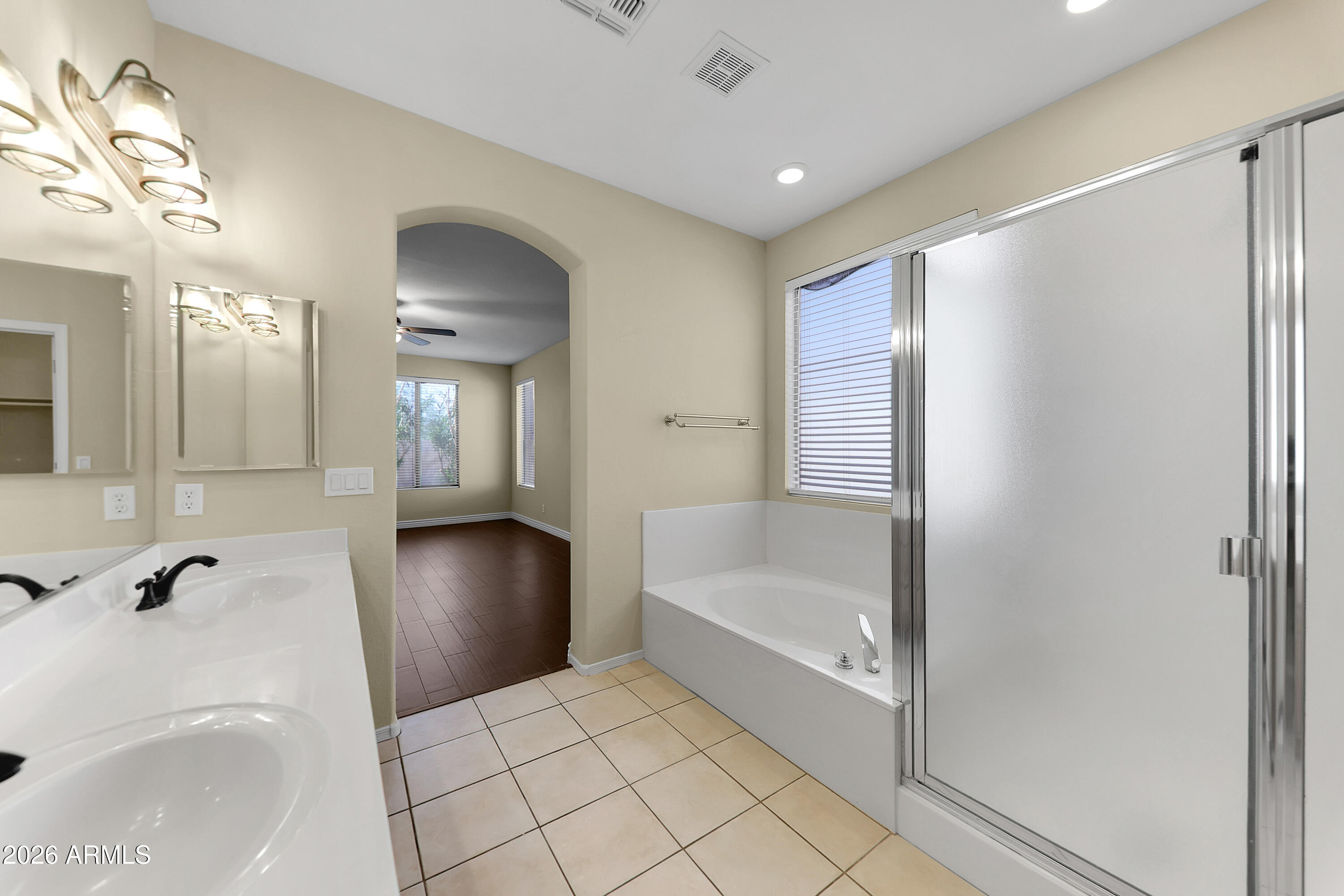 1819 West Nighthawk Way Phoenix, AZ 85045 - Photo 18 of 25 a bathroom with a bathtub and a sink