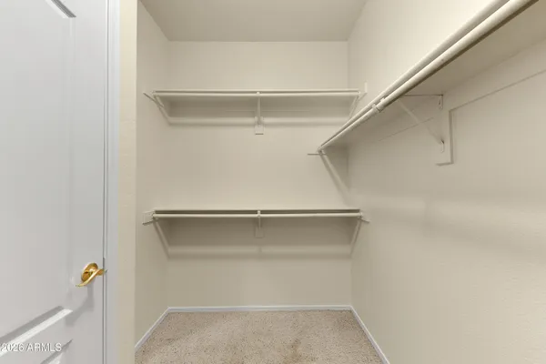 a view of an empty walk in closet